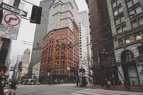 san francisco city buildings under white sky intersection